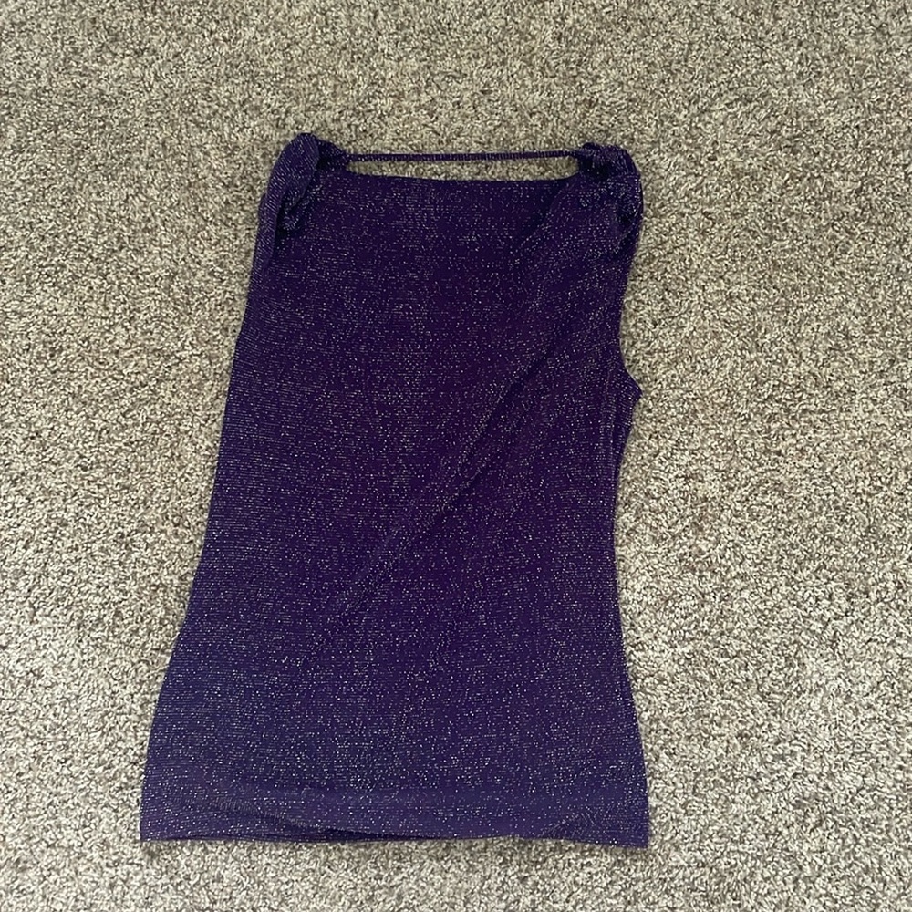 this is a purple sparkly shirt that can be worn to nice restaurants or stores.(S